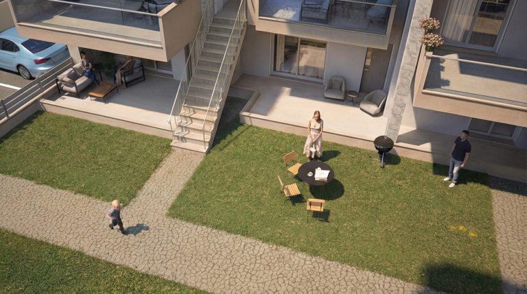 Gardenia 3 elevated view of lawn and terraces in daylight with a family at a garden table and a child running