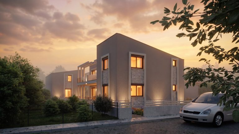 Nea Iraklitsa residence street three-quarter view at sunset, lit windows, pergola facade and a parked car