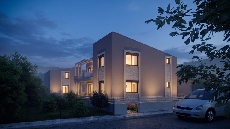 Nea Iraklitsa residence street three-quarter view at blue hour with lit windows and a parked car