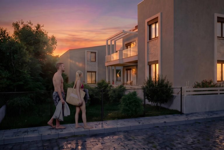 Nea Iraklitsa residence at sunset, couple in swimwear walking past the garden fence and lit balcony