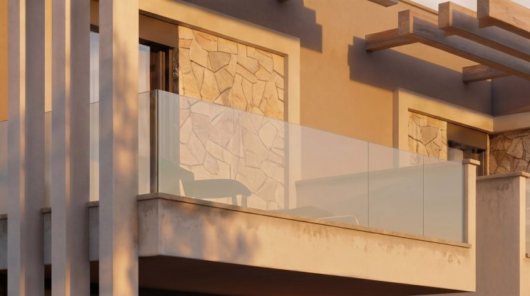 Nea Iraklitsa residence balcony detail at golden hour, glass railing, stone cladding and pergola beams