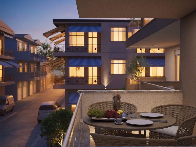 Catherina Residence balcony table at blue hour, street below and lit windows of neighboring buildings