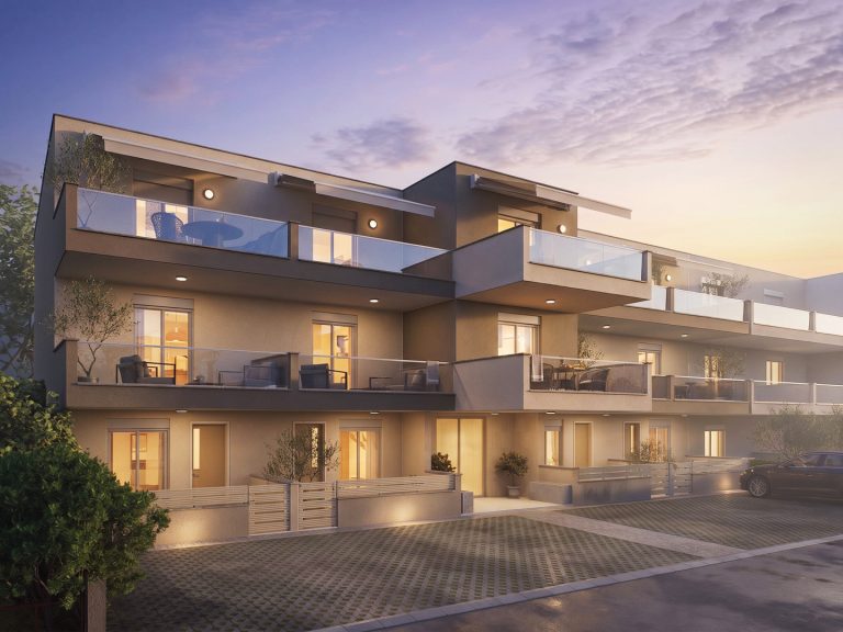 Catherina Residence front three-quarter view at sunset with lit windows, downlights and wall lights