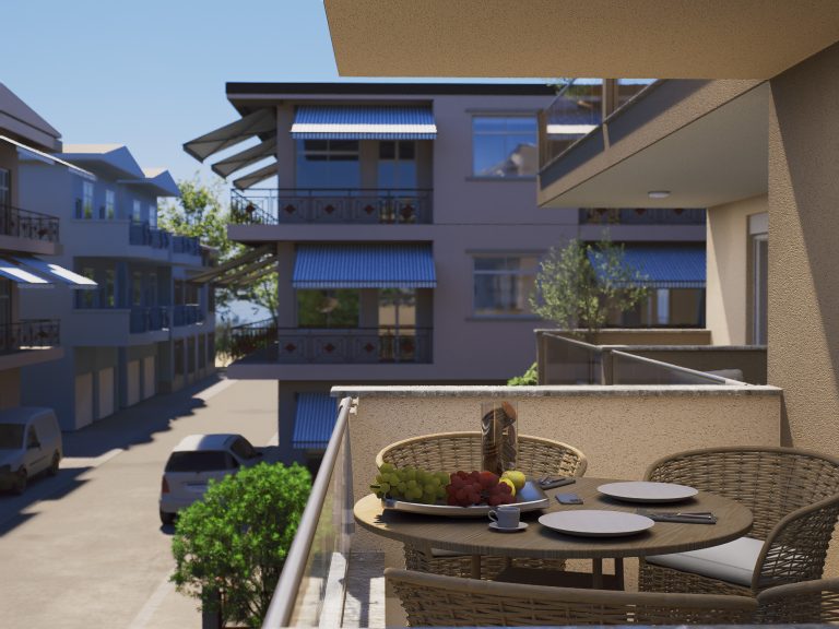 Catherina Residence balcony dining table with fruit, daylight view down the street to neighboring buildings