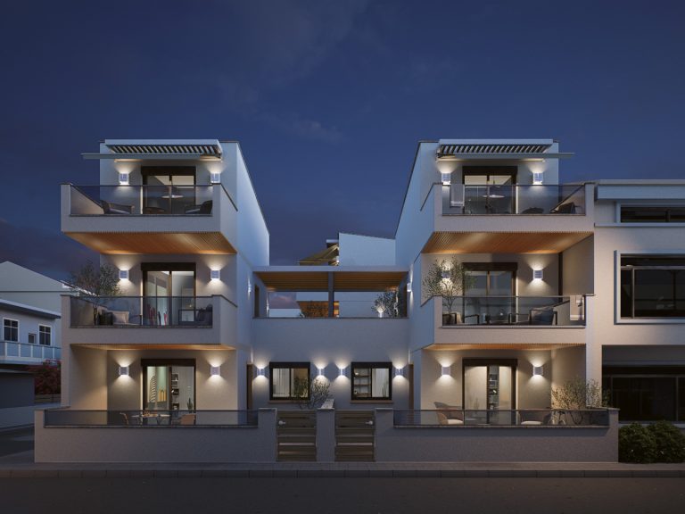 Victoria Residence street facade at night with up-down wall lights, lit balconies and wooden entrance gates