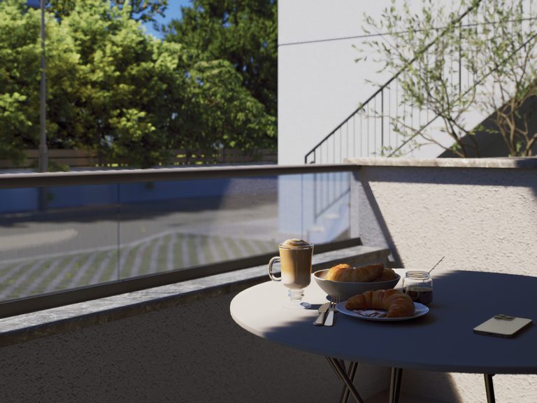 Victoria Residence balcony breakfast table with coffee and croissants in morning sun, glass railing beyond