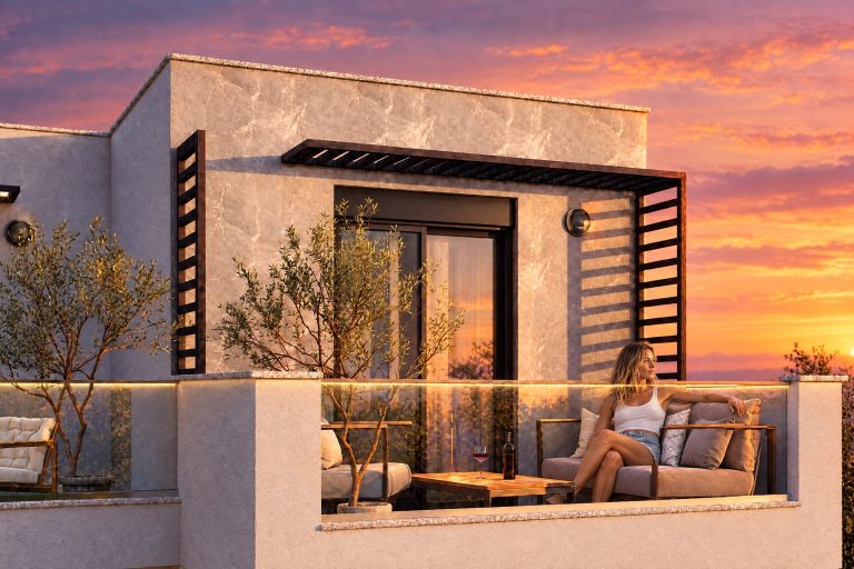 Woman relaxing on the terrace sofa at sunset