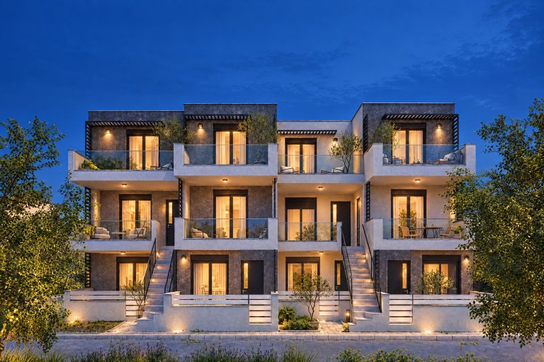 Building exterior at blue hour with exterior lamps lit