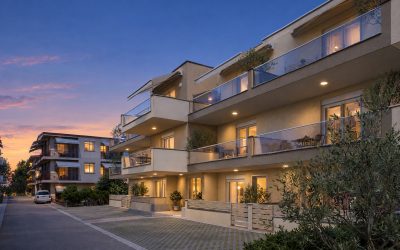 Catherina Residence street corner at blue hour with downlights and rooms lit