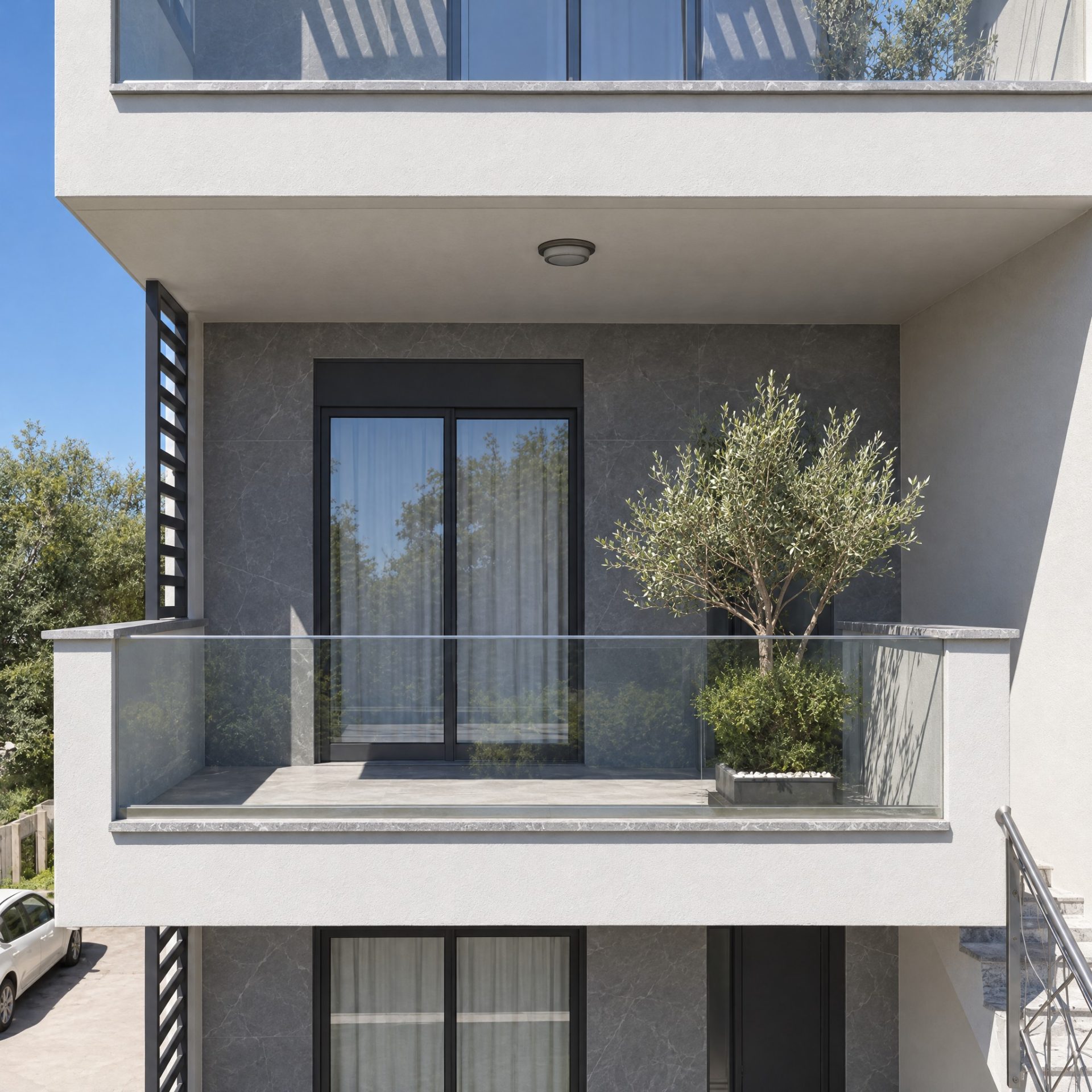 Nika 2 Residence balcony with olive tree and gray stone recess at midday