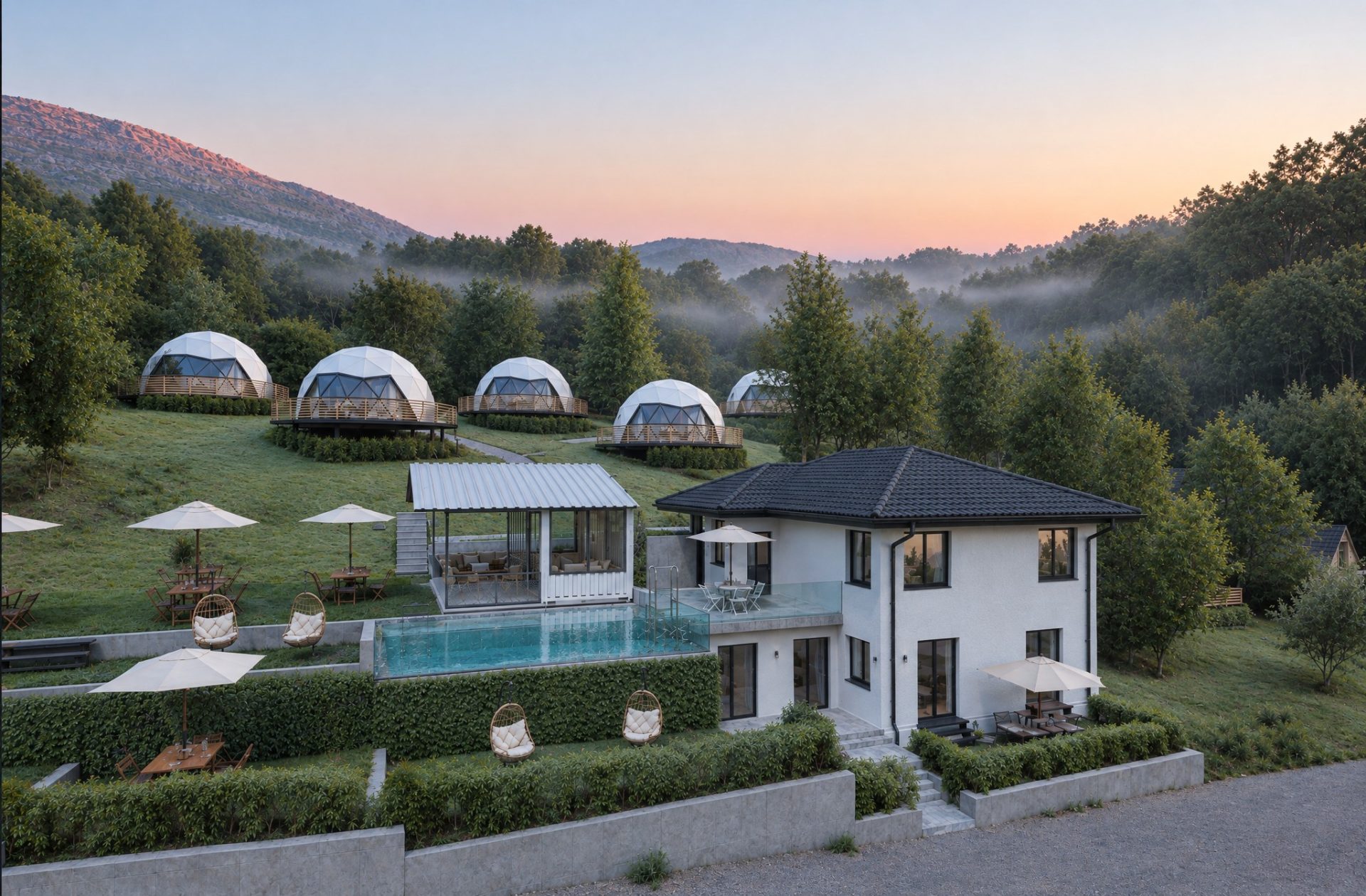 Shumeli Glamping at dawn: the revived guesthouse with pool and glass pavilion below a meadow of geodesic domes, mist in the valley