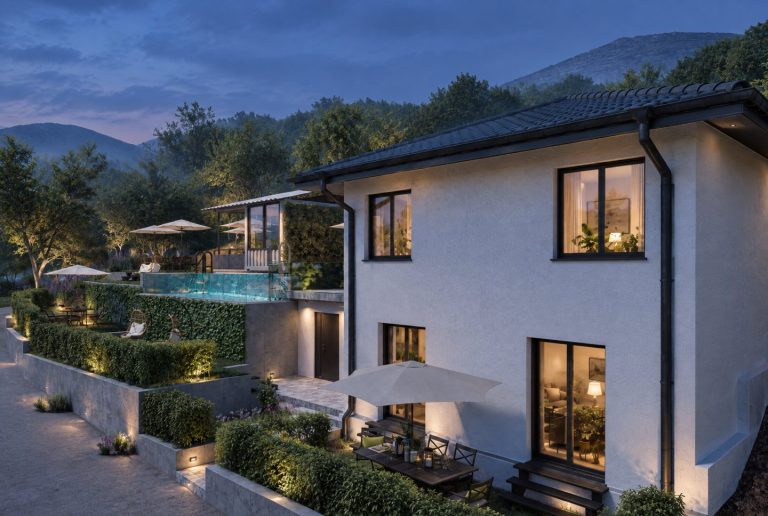 Corner of the revived guesthouse with terrace and pool at blue hour